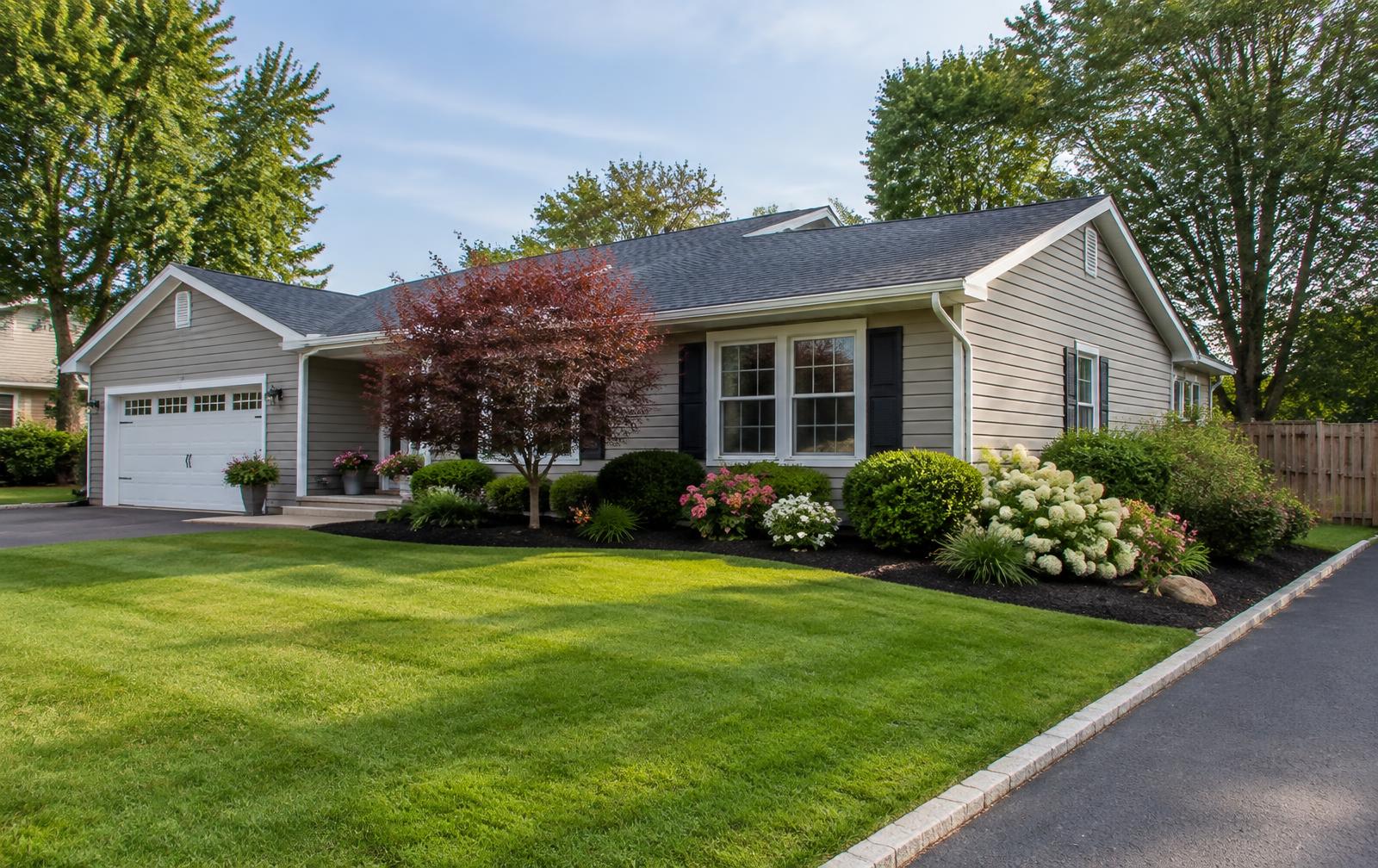 After landscaping: ranch home and front lawn